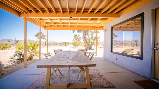 view of patio / terrace with a mountain view