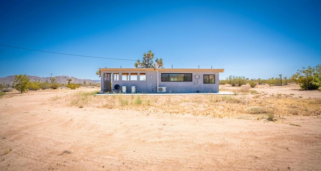 pueblo revival-style home with a mountain view