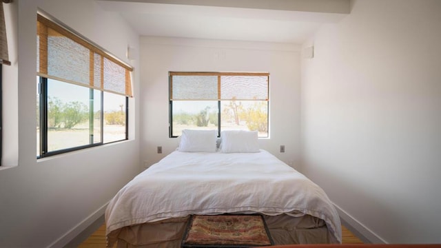 bedroom with hardwood / wood-style floors