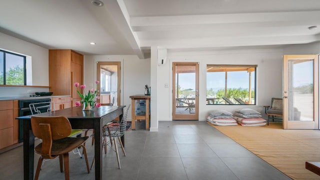 dining area featuring tile patterned floors and a wealth of natural light