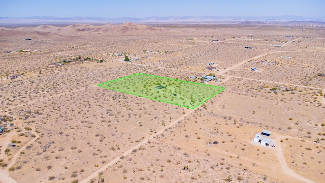 drone / aerial view featuring a mountain view