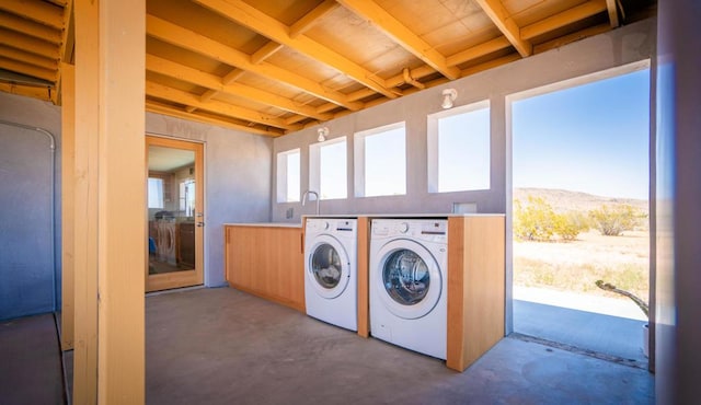 laundry area with a mountain view and washing machine and dryer