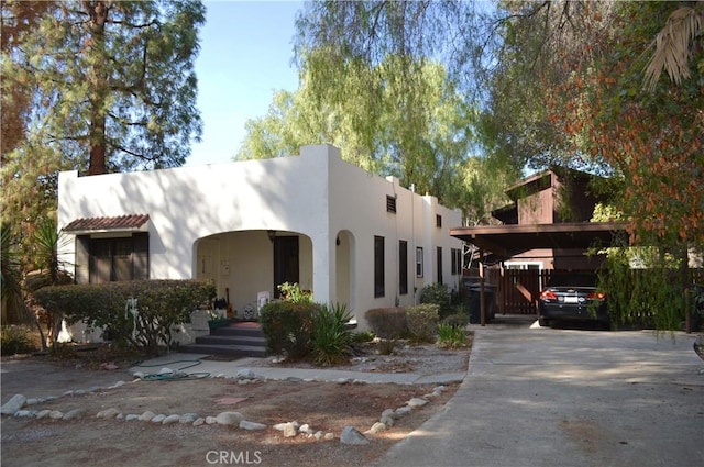 view of front of home with a carport