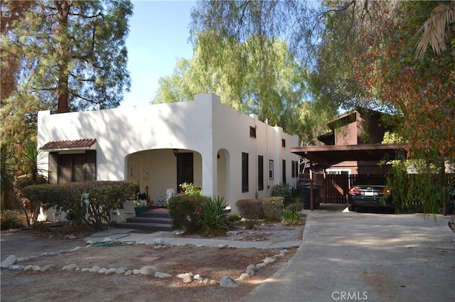 1113 Yale Ave, Claremont, CA 91711 - southwest-style home featuring a gate, stucco siding, and concrete driveway