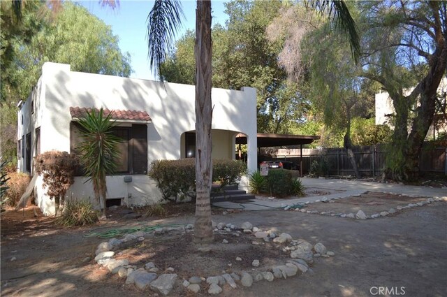 exterior space with a carport