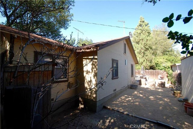 view of side of home featuring a patio area