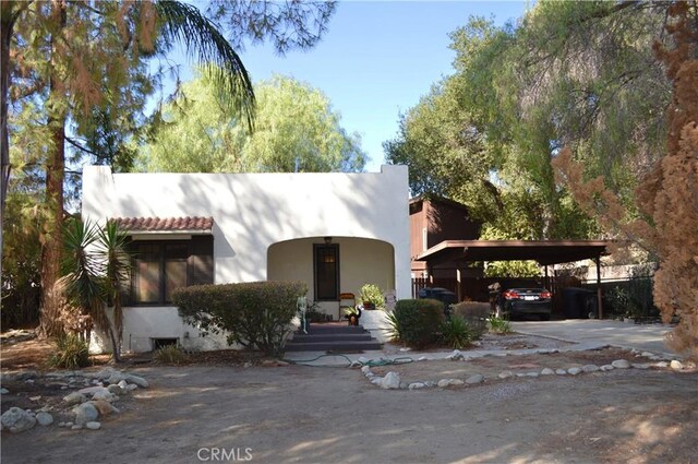 view of front of home featuring a carport