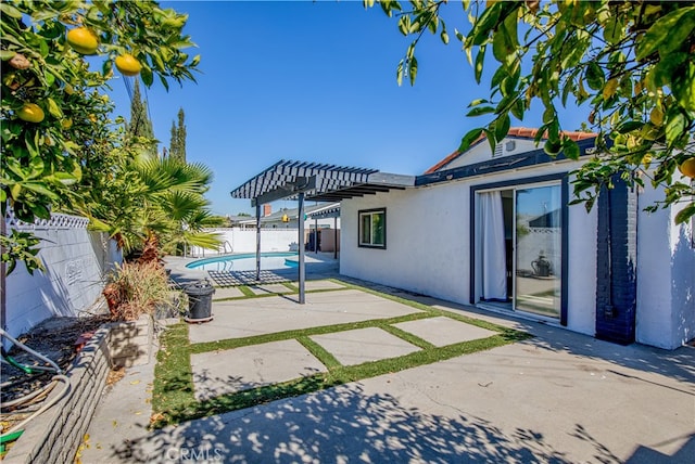 view of patio / terrace with a fenced in pool and a pergola