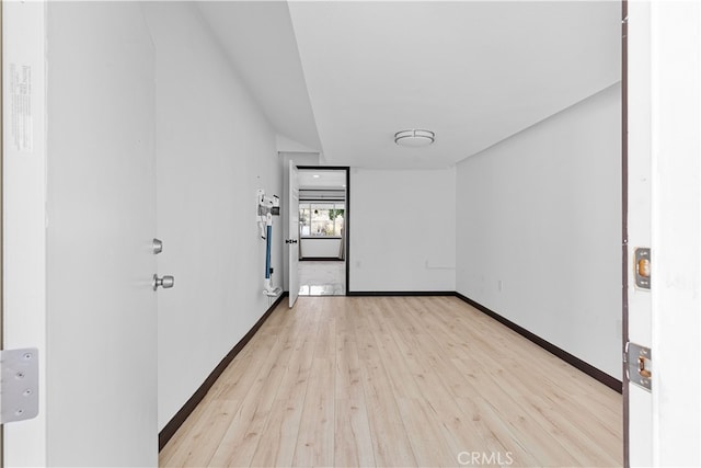 spare room with light hardwood / wood-style floors