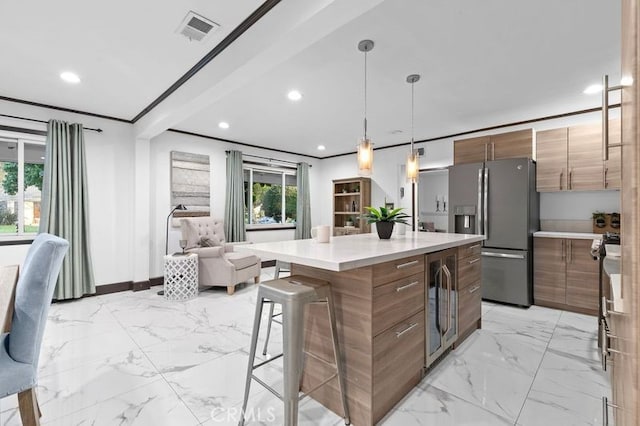 kitchen with stainless steel refrigerator with ice dispenser, decorative light fixtures, beverage cooler, and a healthy amount of sunlight