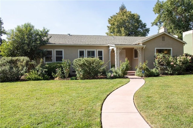 ranch-style house with a front lawn