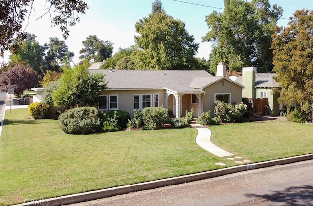 ranch-style home featuring a front yard