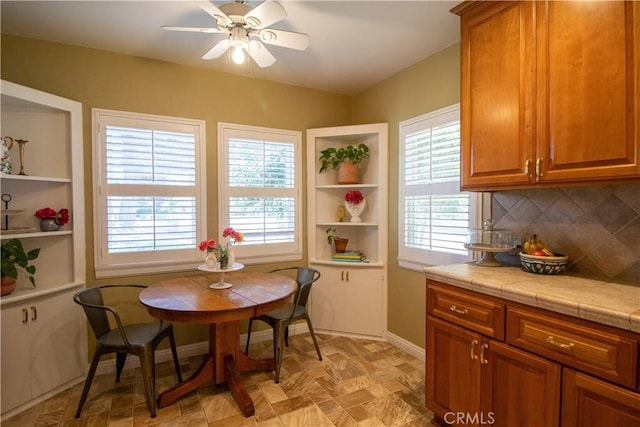 dining room featuring ceiling fan