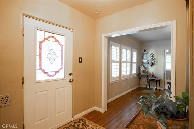 entryway with hardwood / wood-style flooring