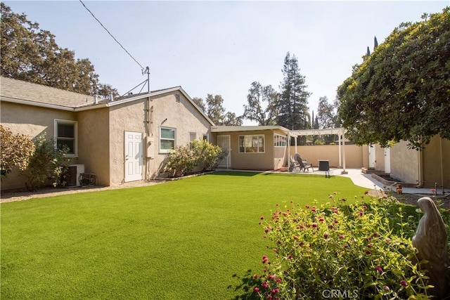 view of yard featuring central AC unit and a patio area