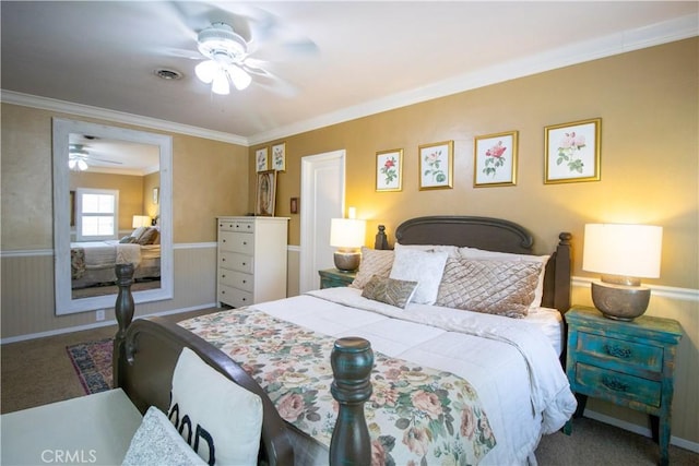 bedroom with carpet flooring, ceiling fan, and crown molding