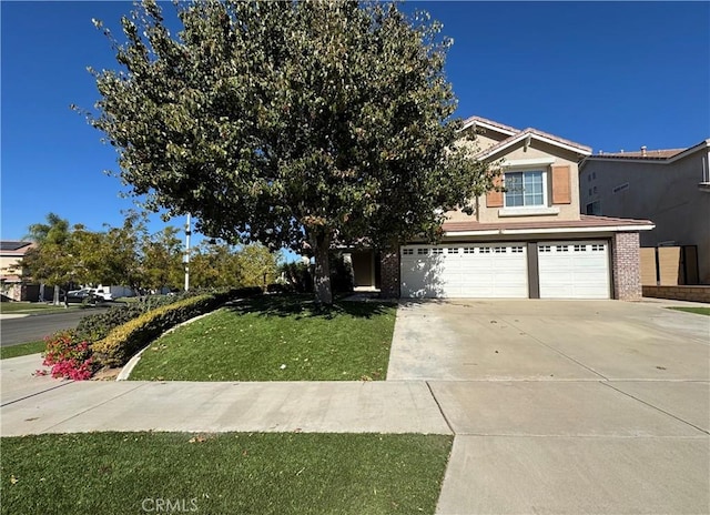 view of front of property featuring a garage and a front yard