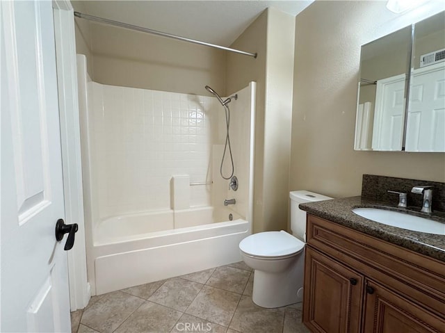 full bathroom featuring tile patterned floors, tiled shower / bath combo, toilet, and vanity