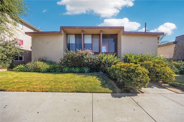 exterior space with a front lawn