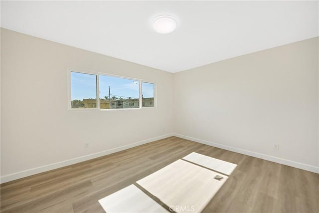 empty room with wood-type flooring