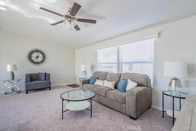 living room featuring ceiling fan and light colored carpet