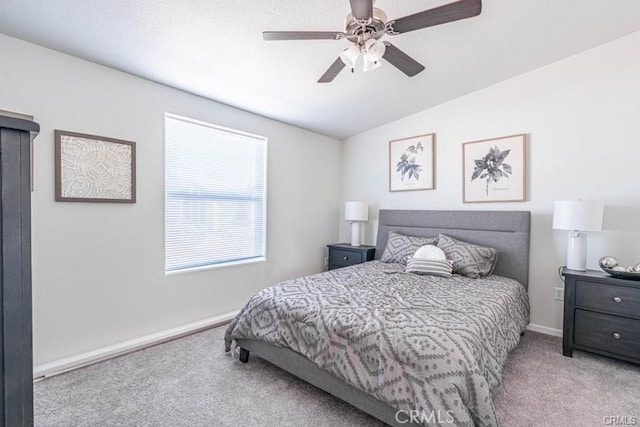 bedroom with ceiling fan and light colored carpet