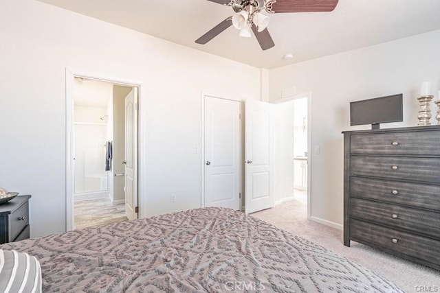 bedroom with ceiling fan and light carpet