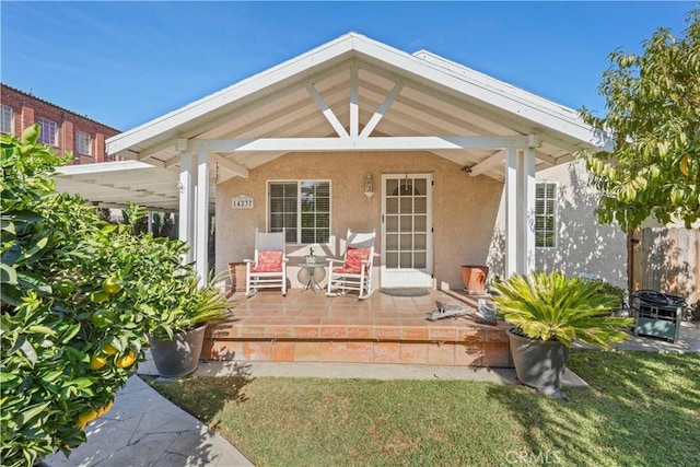 exterior space with a yard and a porch