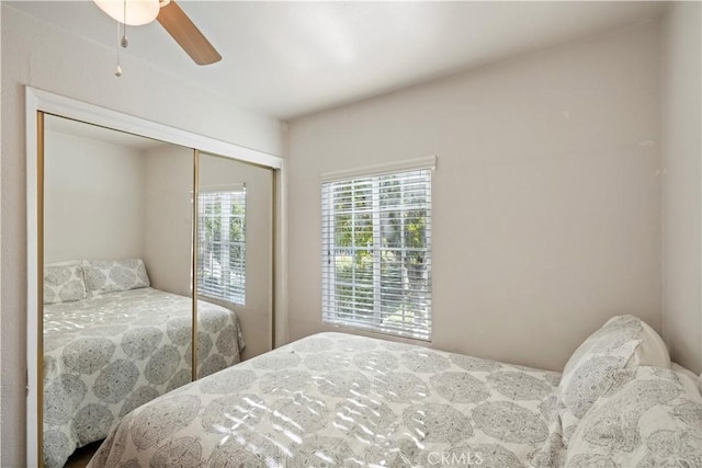 bedroom featuring french doors, a closet, and ceiling fan