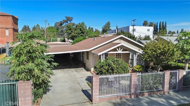 view of front of property featuring a carport