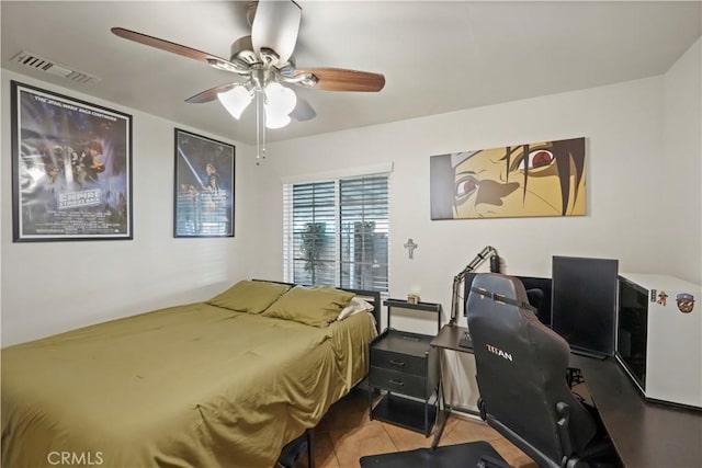 tiled bedroom with ceiling fan