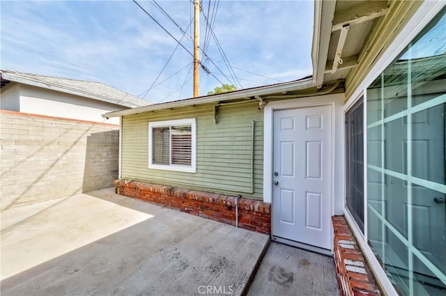 doorway to property with a patio