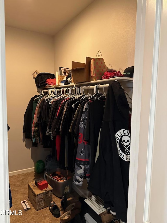 walk in closet with carpet floors