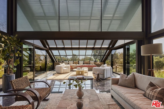 sunroom / solarium featuring lofted ceiling