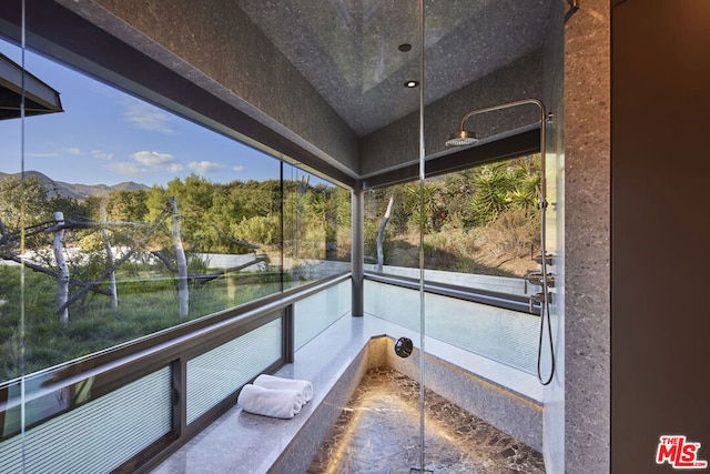 interior space featuring a mountain view and a balcony