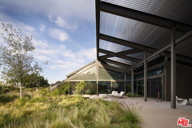 rear view of house featuring a patio