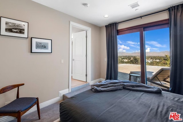 carpeted bedroom featuring access to exterior