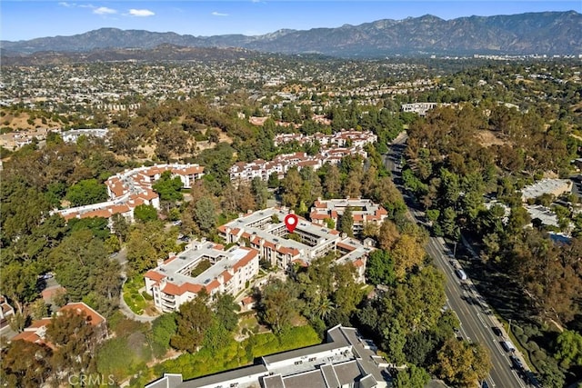 birds eye view of property featuring a mountain view