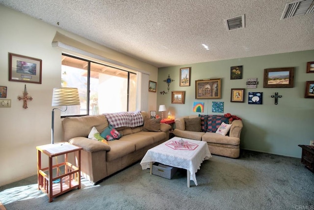 carpeted living room with a textured ceiling