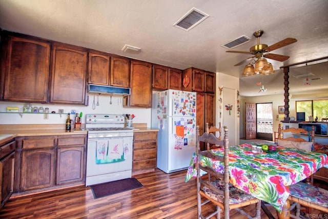 kitchen with ceiling fan, dark hardwood / wood-style flooring, white appliances, and a textured ceiling