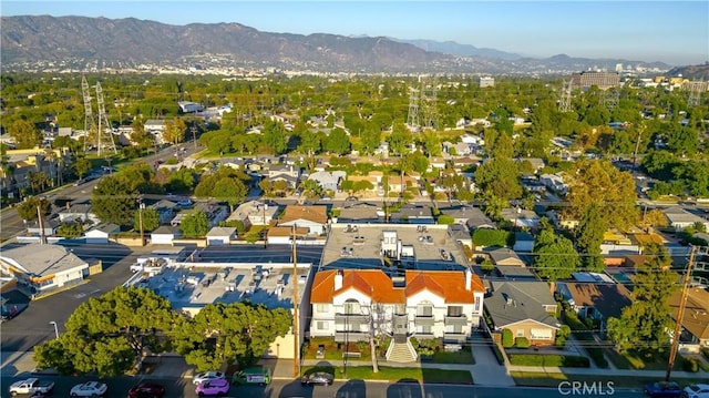 birds eye view of property with a mountain view