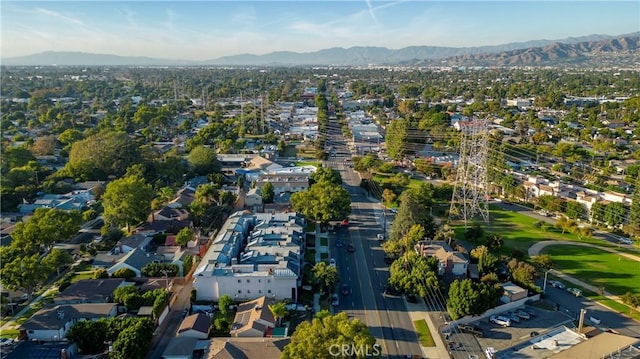 birds eye view of property featuring a mountain view