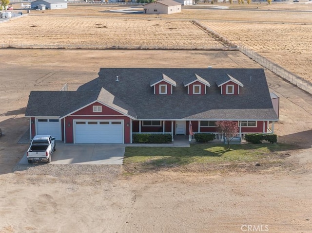 view of front of house featuring a porch and a garage