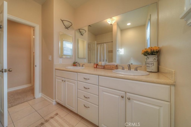 bathroom with tile patterned floors and vanity