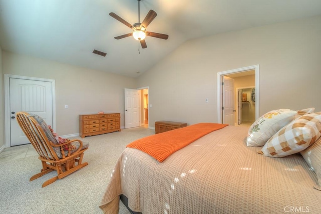 bedroom featuring light colored carpet, vaulted ceiling, and ceiling fan