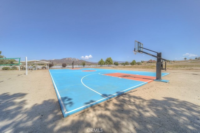 view of sport court with a mountain view