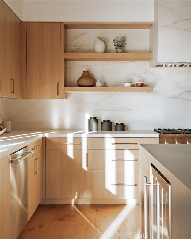 kitchen with light brown cabinets, backsplash, wine cooler, light hardwood / wood-style flooring, and stainless steel dishwasher