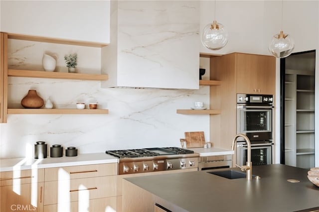 kitchen with appliances with stainless steel finishes, backsplash, decorative light fixtures, and sink