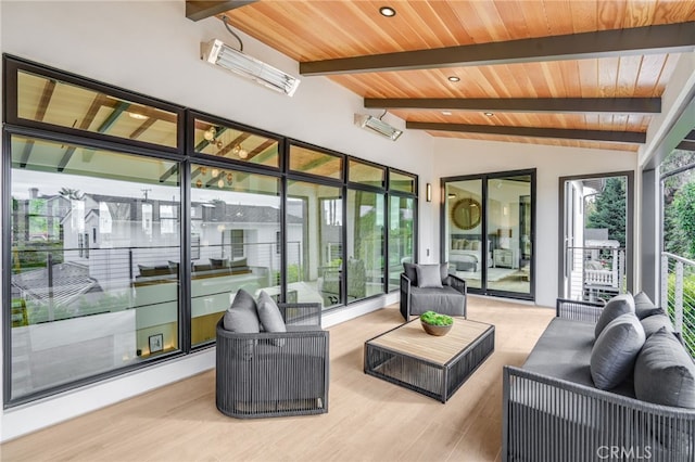 interior space featuring vaulted ceiling with beams, light hardwood / wood-style flooring, and wood ceiling