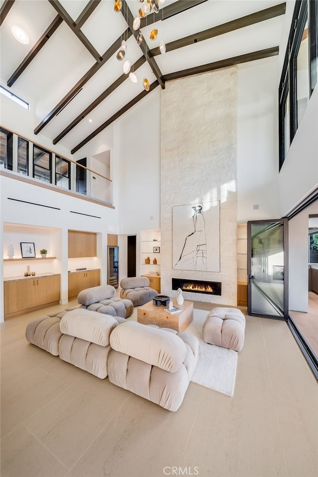 tiled bedroom featuring beam ceiling, a fireplace, and high vaulted ceiling